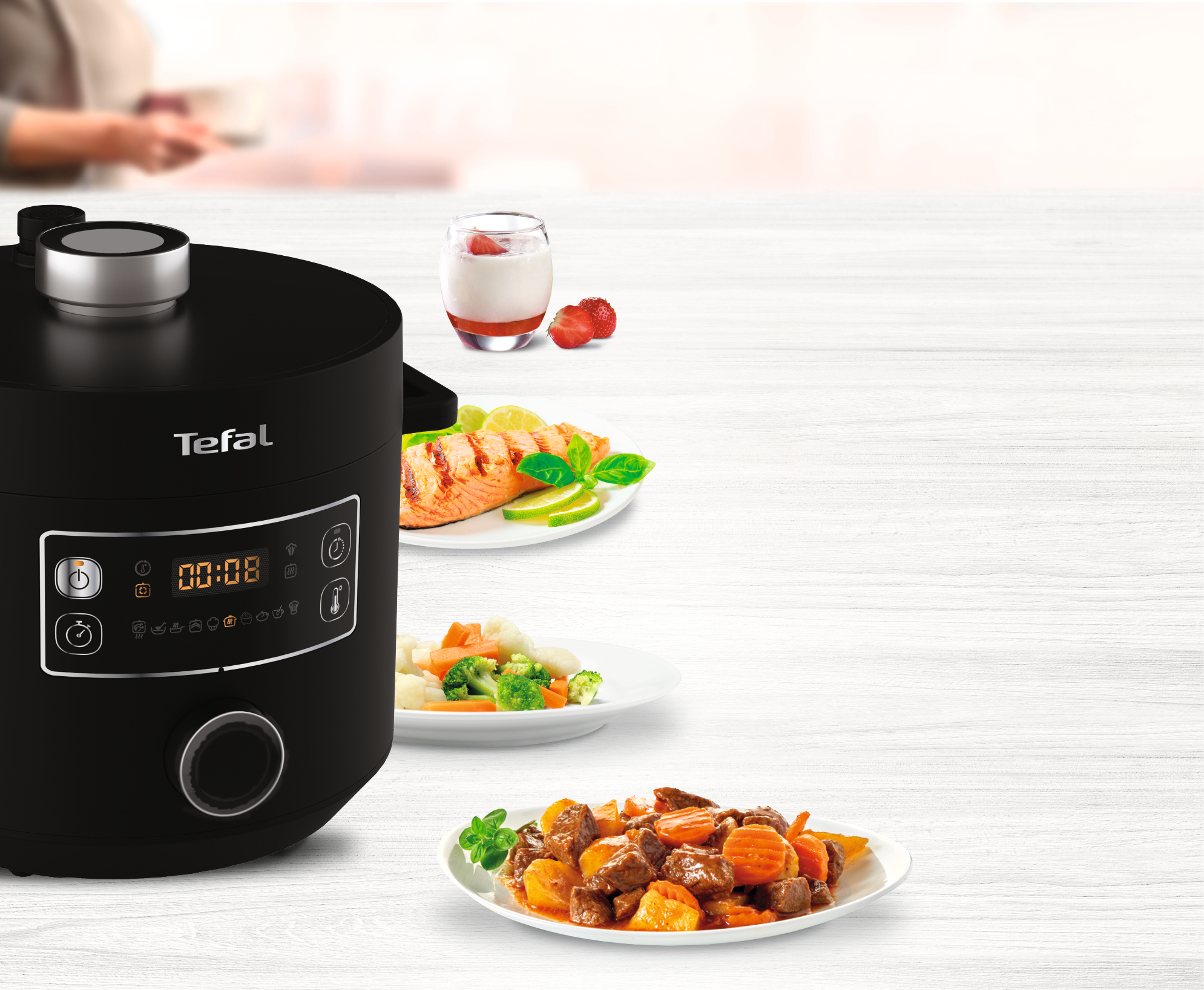 Ein Tefal Dampfbügeleisen und Produktinformationen.