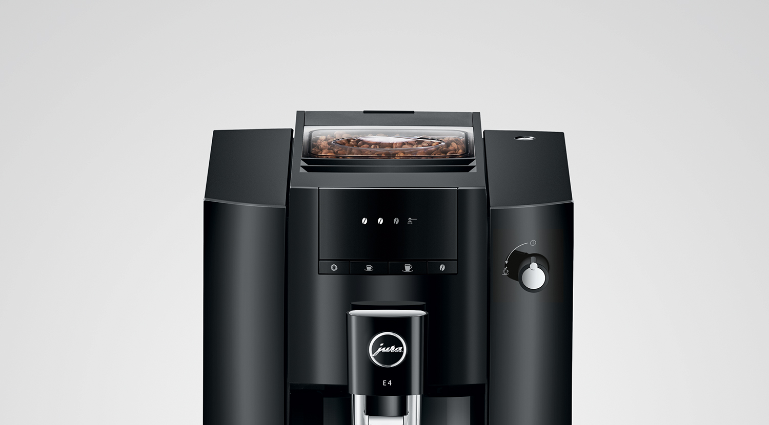 Black Jura E4 coffee machine. Top has bean container. White background.