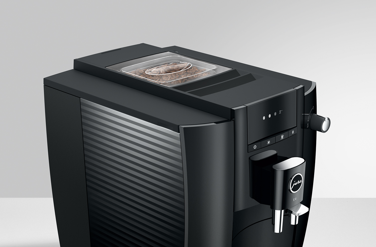 Black coffee machine with a bean container and a control panel, on a white background.