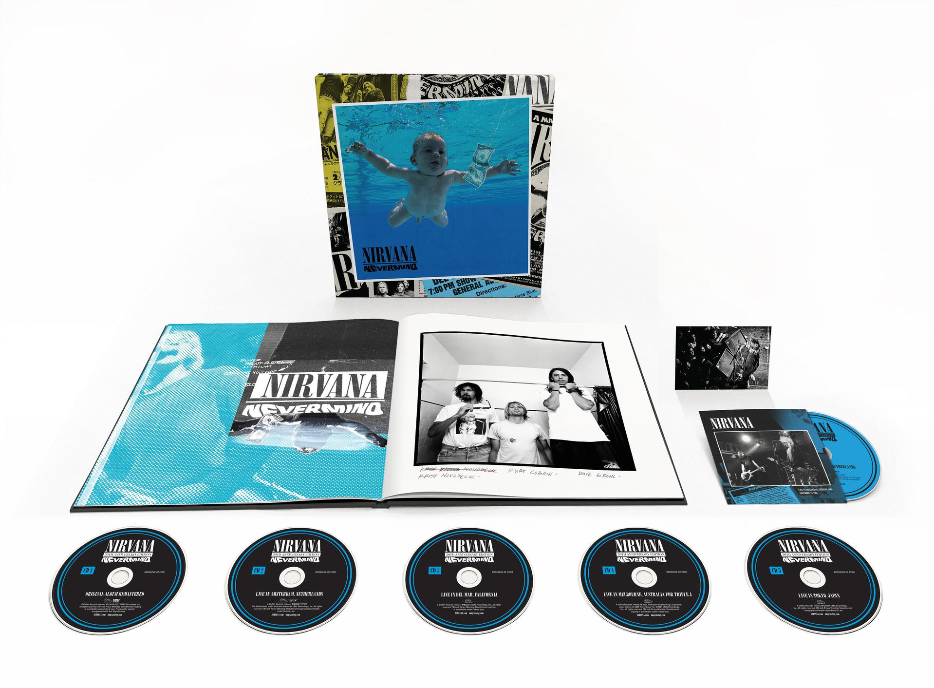 Nirvana's Nevermind album box set with CDs, a booklet, and a baby swimming image.
