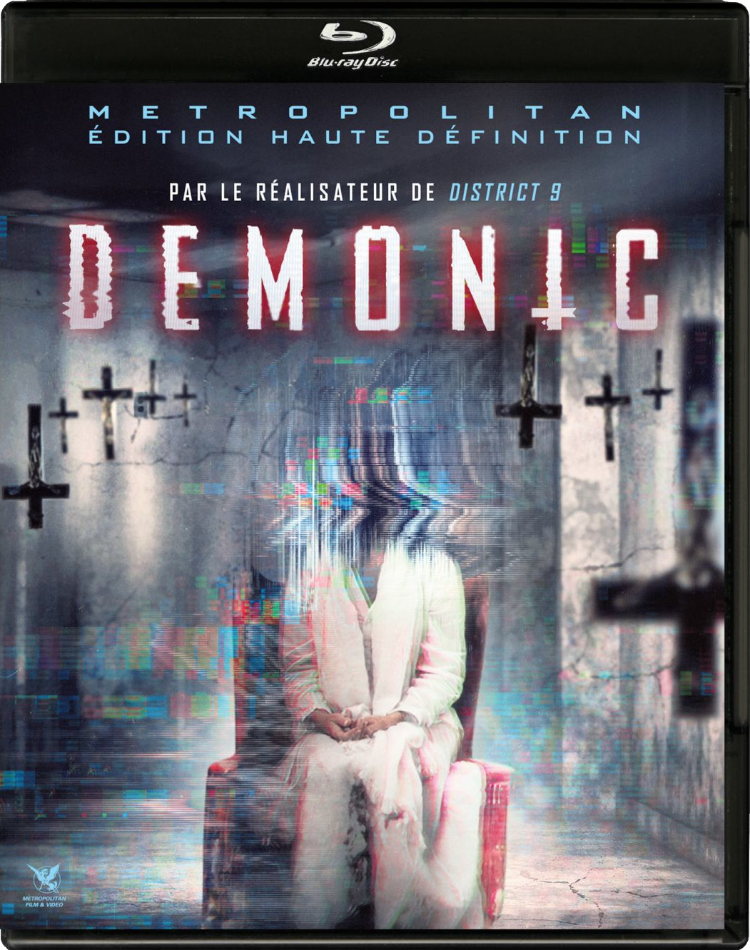 Couverture Blu-ray de 'Demonic' avec un visage déformé, des croix et un fond sombre.