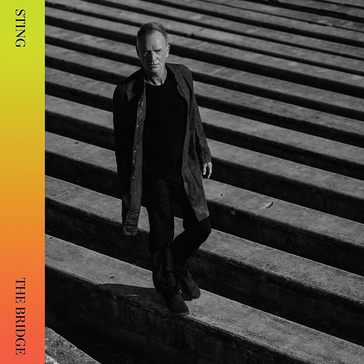 Sting lépcsőn sétál, album borítója sárga-narancs gradienssel, 'The Bridge' szöveggel.