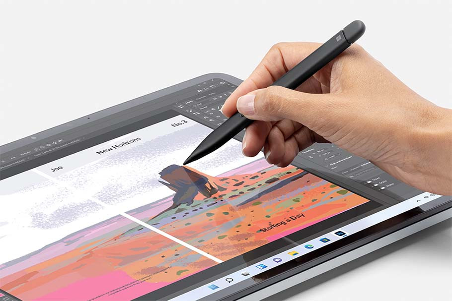 Eine Hand, die einen schwarzen Stift über einem Tablet hält, mit farbiger Zeichnung.