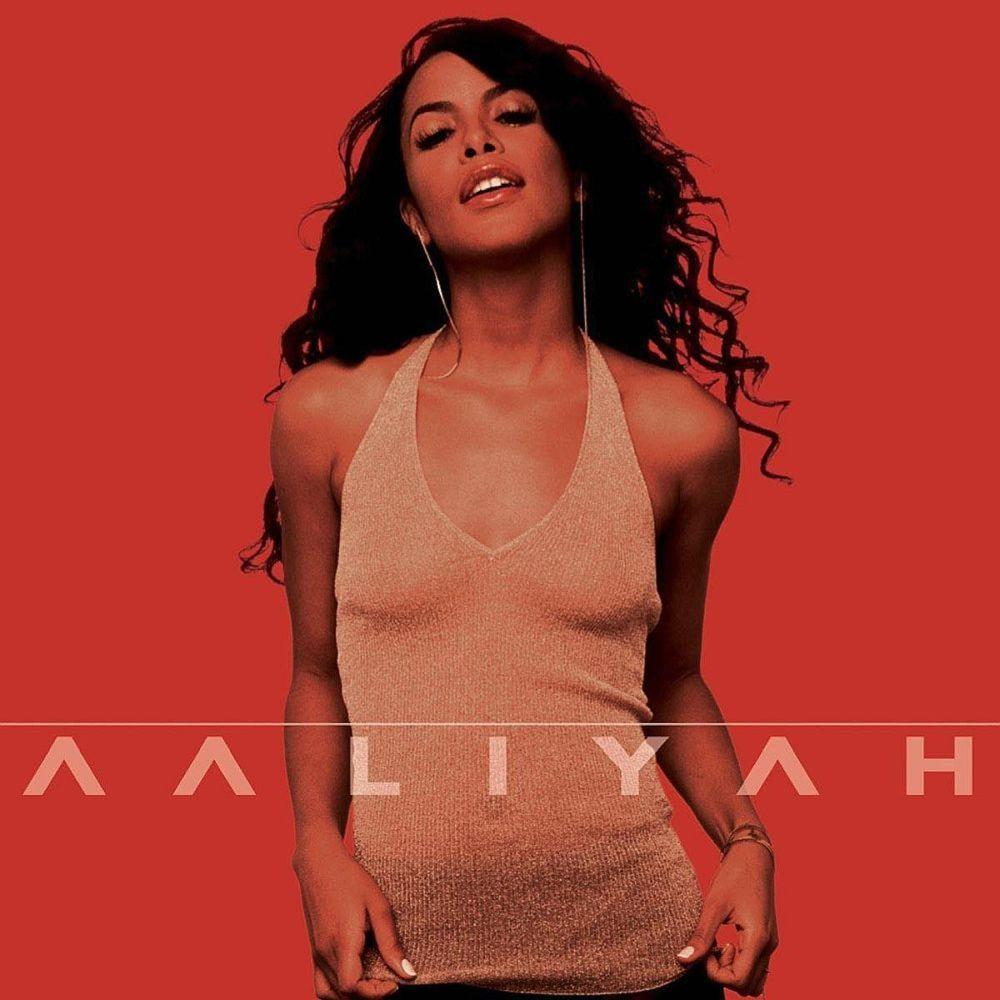 Aaliyah album borítója. Arany nyakpántos felsőt visel. A háttér piros, alatta Aaliyah neve.