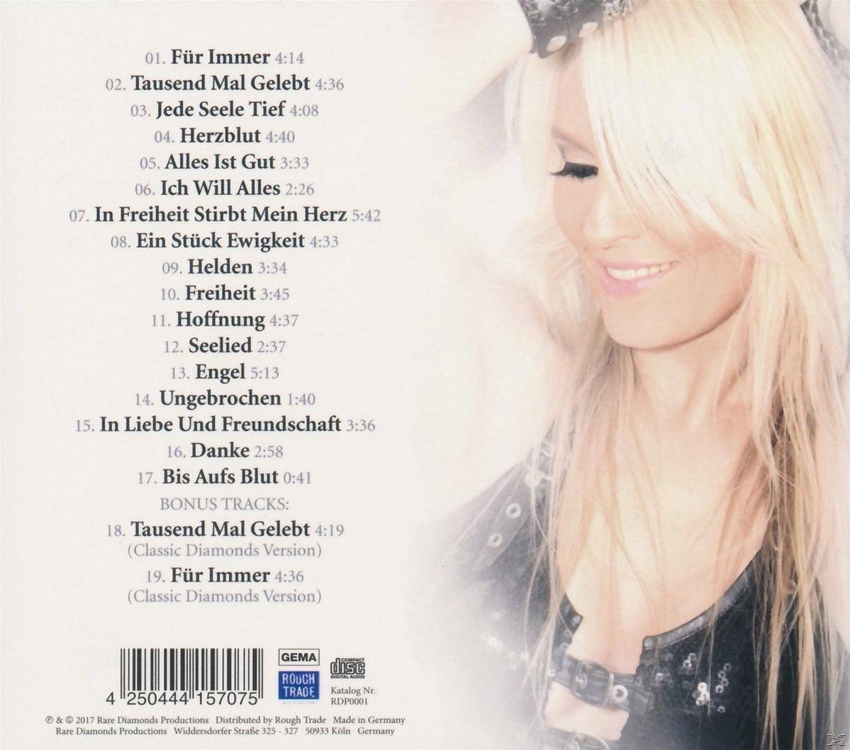 Albumcover zeigt eine lächelnde blonde Frau. Text listet Songtitel und einen Barcode auf.