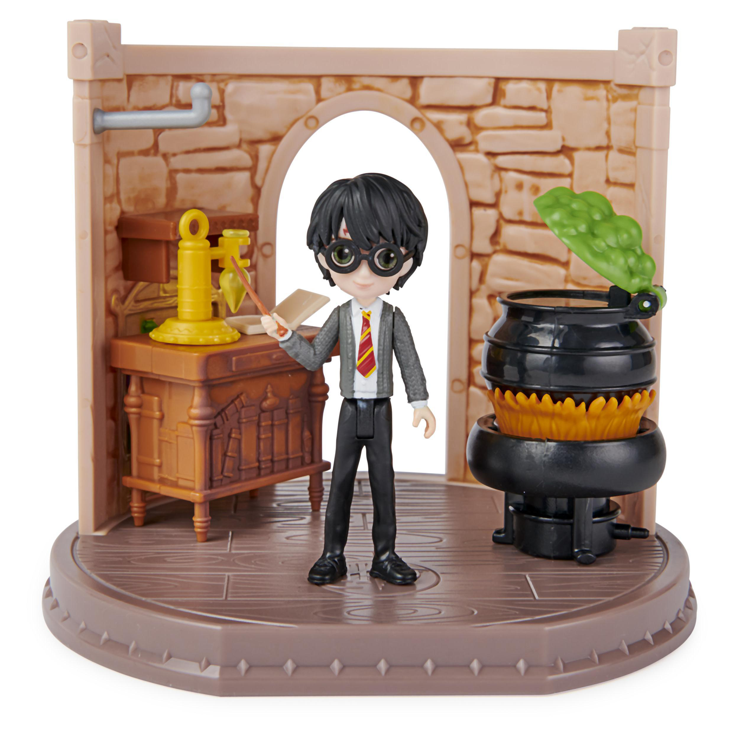 Harry Potter Figur in einem Diorama. Er hält einen Zauberstab in einer Zaubertrank-Umgebung.