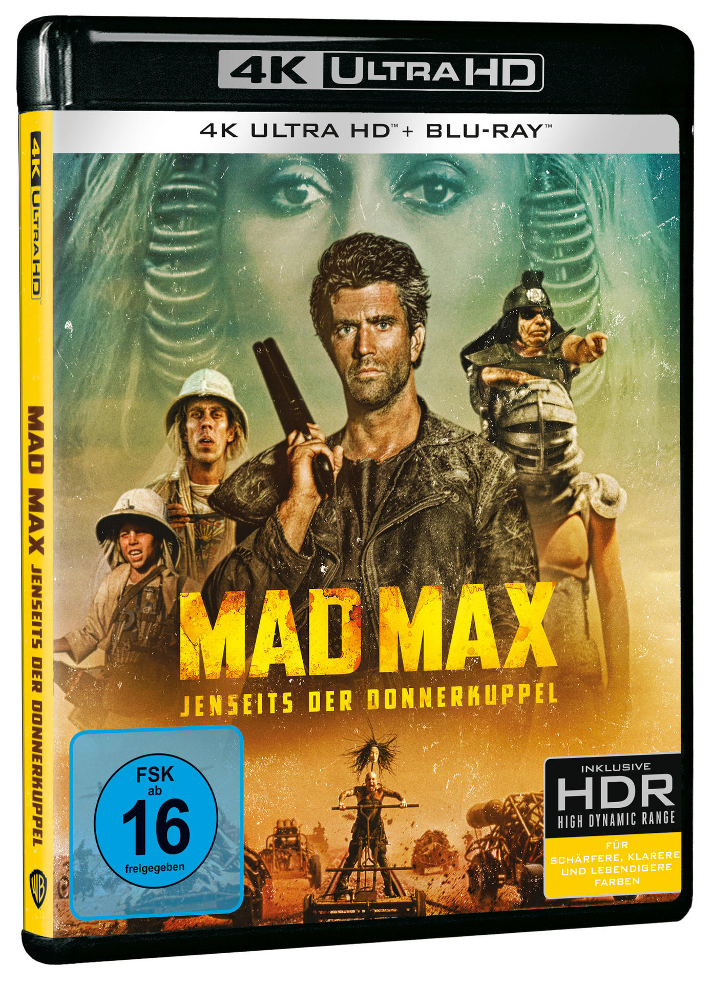 Mad Max Filmcover auf Deutsch. Zeigt einen Mann mit Waffe und zwei weitere Figuren.