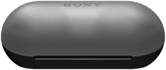 Egy zárt, sötétszürke Sony fülhallgató töltőtok, lekerekített formával és egy kis horonnyal.