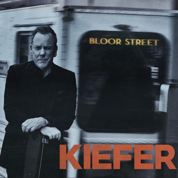 Albumcover mit Kiefer Sutherland neben einem Zug, Titel 'Bloor Street' und Kiefer's Name.