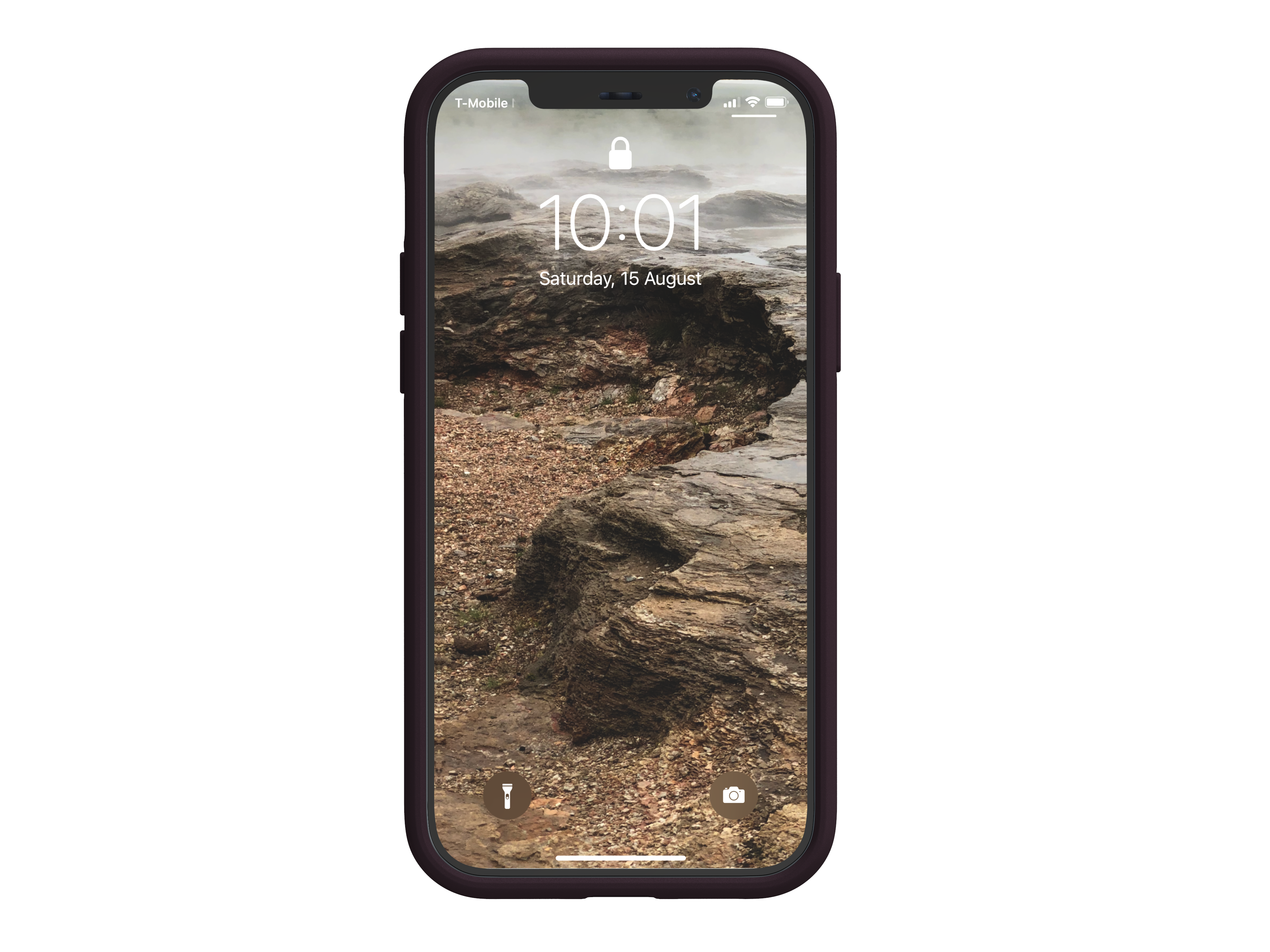 Ein Telefon auf schwarzer Oberfläche, das eine felsige Landschaft mit einem Sperrbildschirm zeigt.