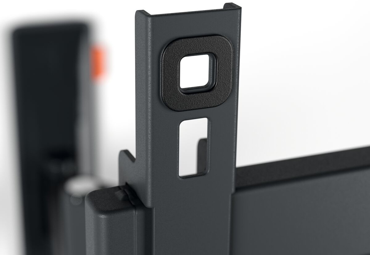 Close-up of a dark gray metal bracket with square and rectangular holes, white background.