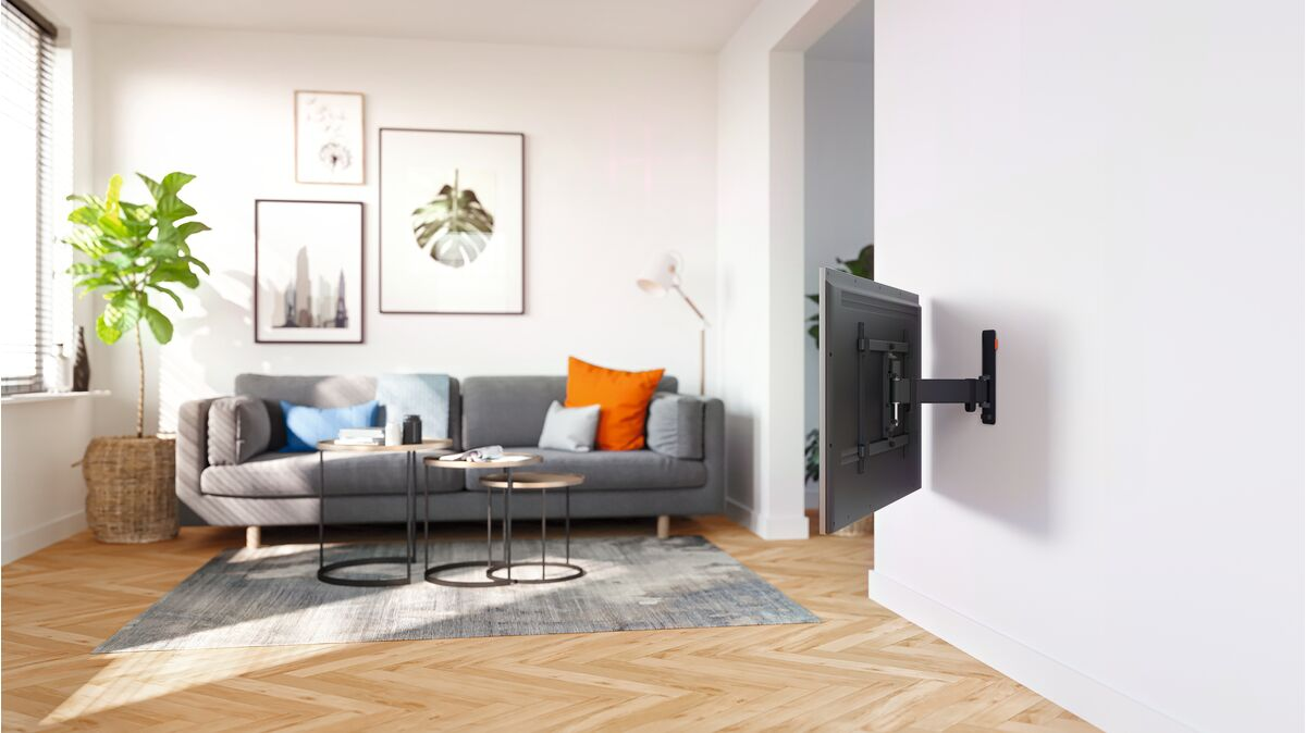 A black pellet stove with a glass door is against a black background.