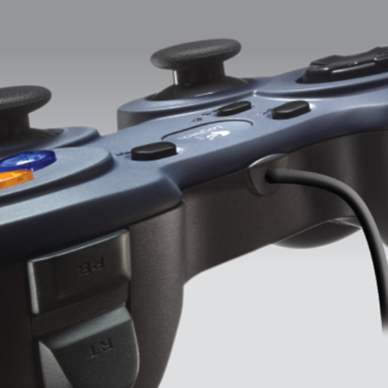 A close-up of a gamepad with buttons and a cable. The gamepad is dark blue.