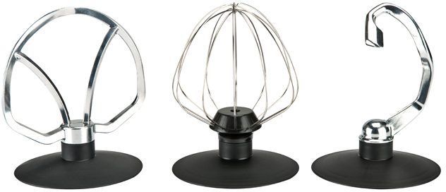Three different mixer attachments on black stands. A flat paddle, a whisk, and a dough hook.