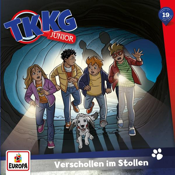 TKKG Junior Buchcover: Vier Kinder und ein Hund erkunden eine Höhle mit Taschenlampen.