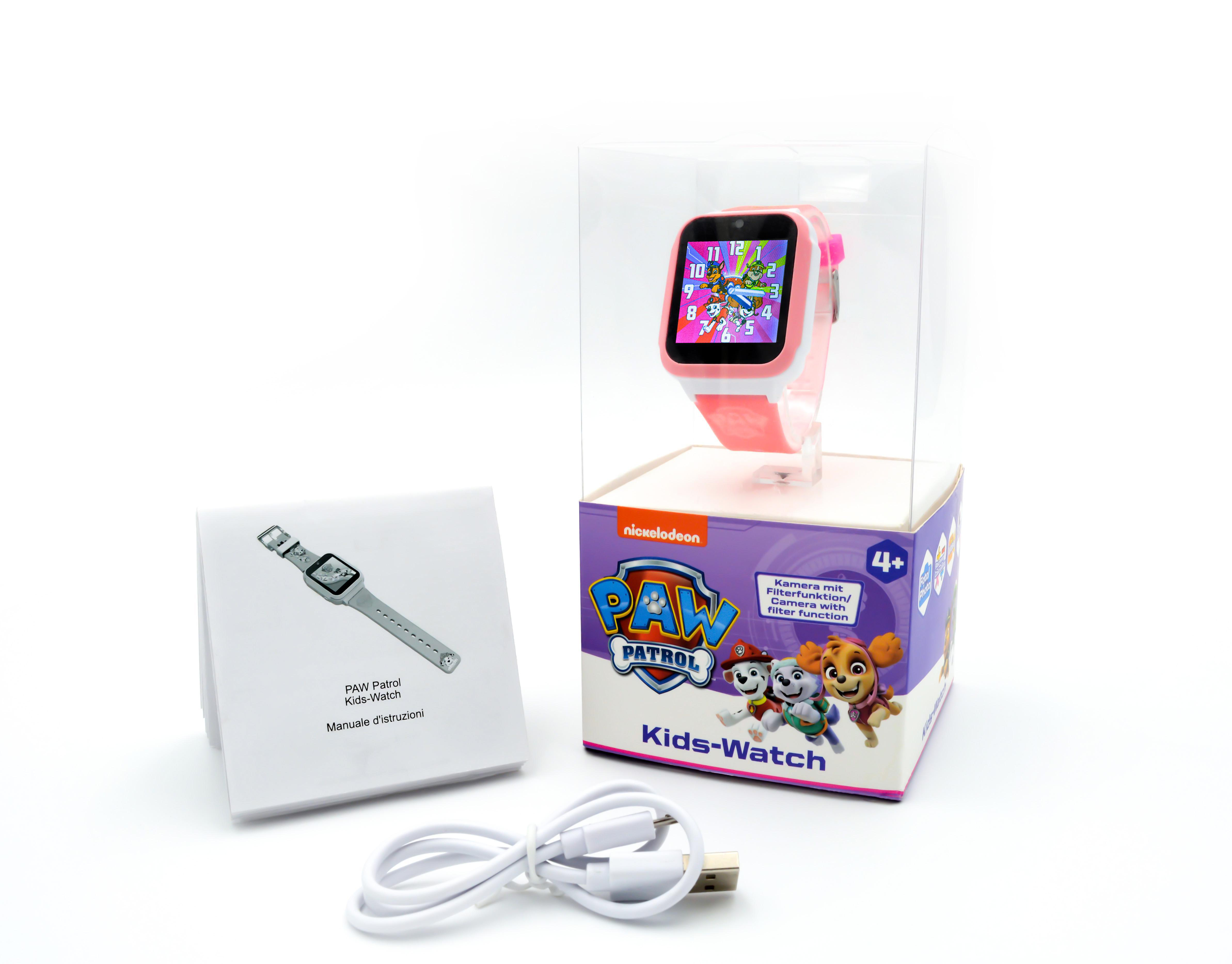 Eine rosa Paw Patrol Kinderuhr in einer Box mit Ladekabel und Handbuch.