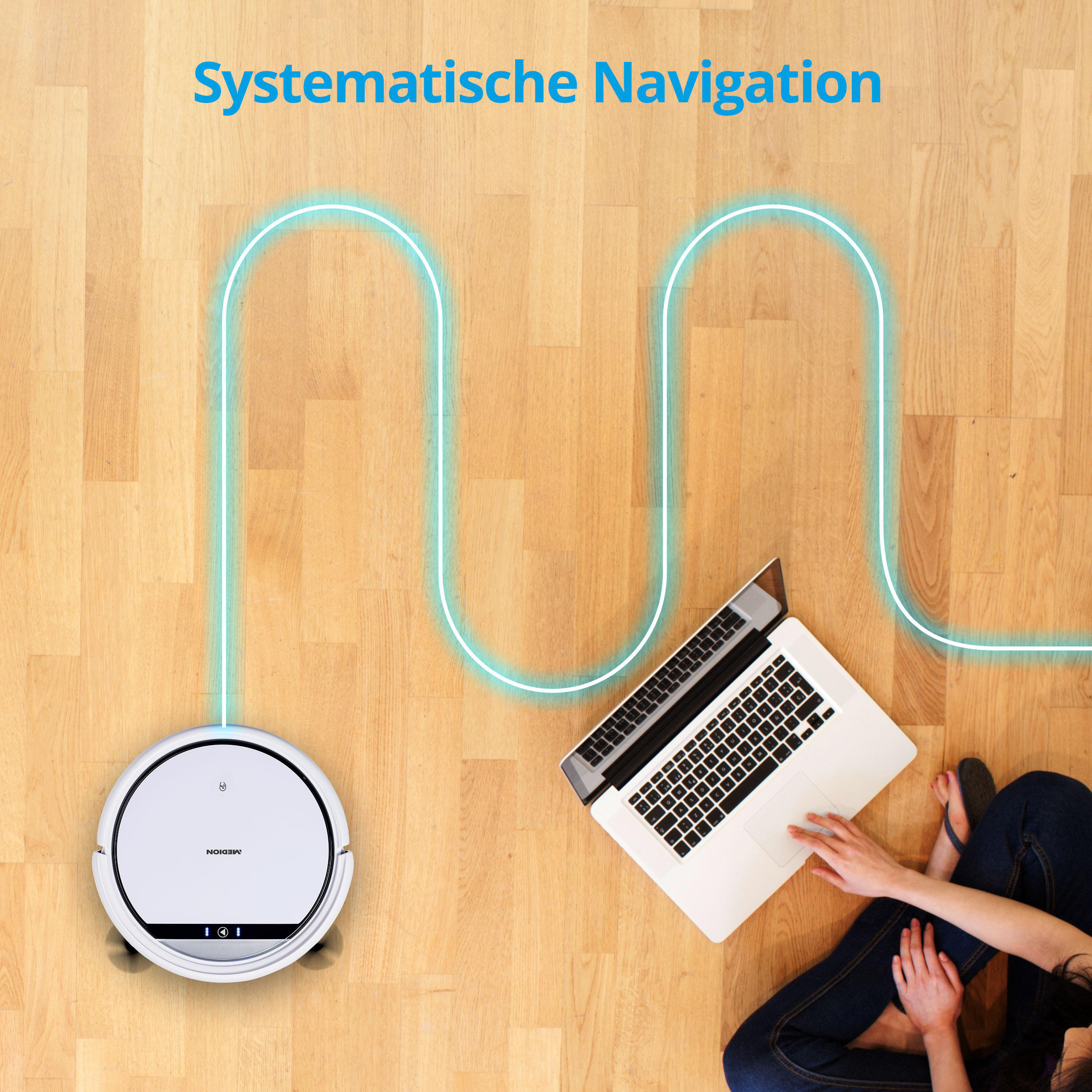 Ein Roboter-Staubsauger auf einem Holzboden, mit einem Laptop und einer Person.