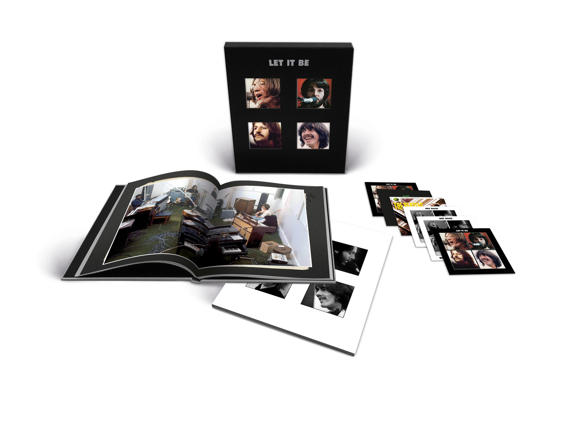 The Beatles' 'Let It Be' Album-Box-Set. Albumcover, Fotobuch und Albumhüllen sind sichtbar.