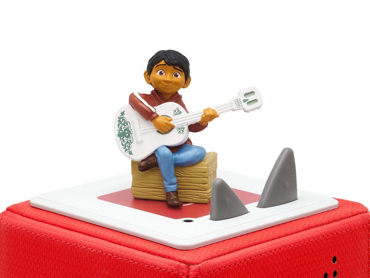 Spielfigur eines Jungen, der Gitarre spielt. Haie sind im Hintergrund. Eine rote Plattform ist im Vordergrund.
