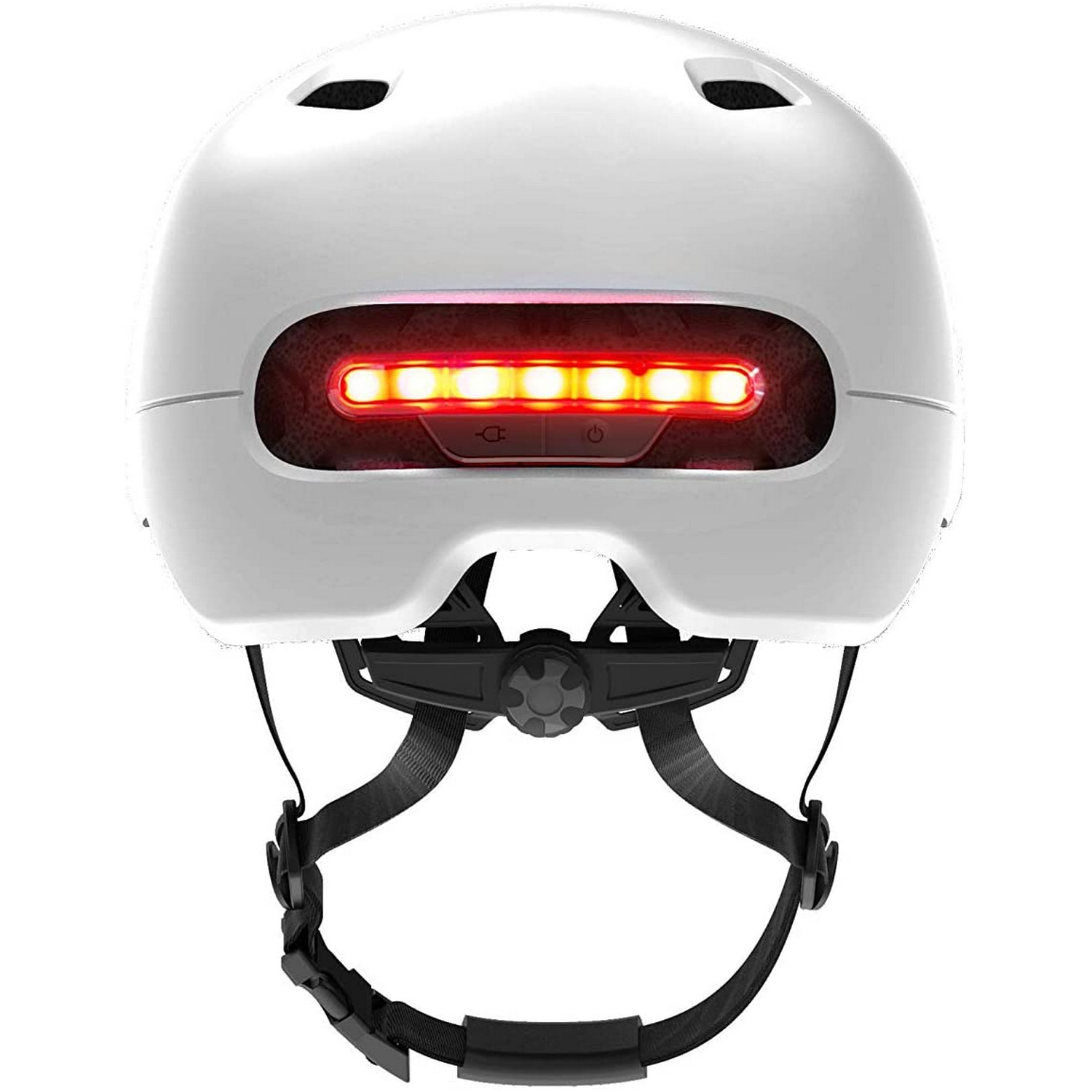 Casco de bicicleta blanco con tira de luz roja trasera y correas negras. Los botones están en la parte inferior.
