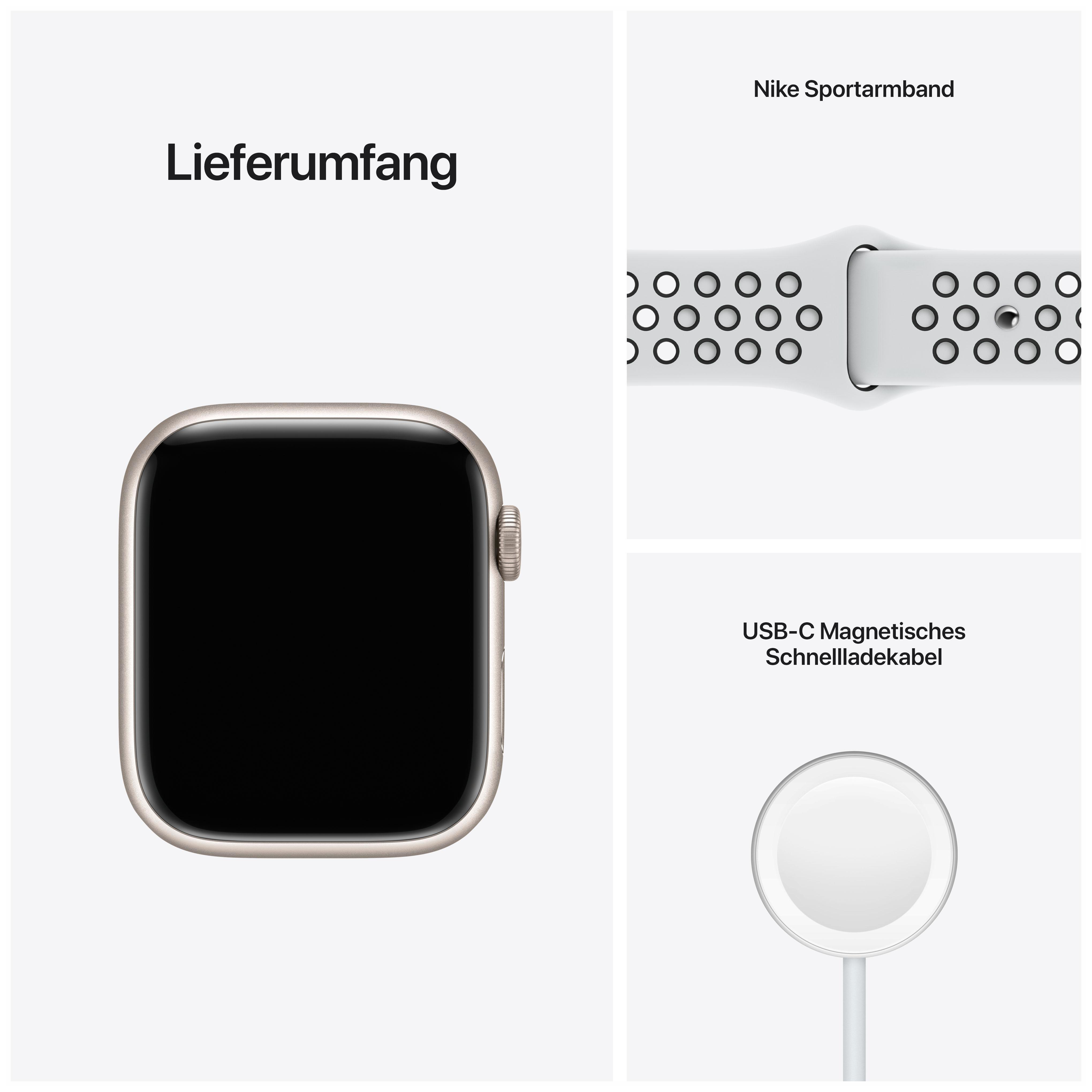Eine Apple Watch, ein weißes Sportarmband und ein magnetisches Ladekabel, auf weißem Grund.