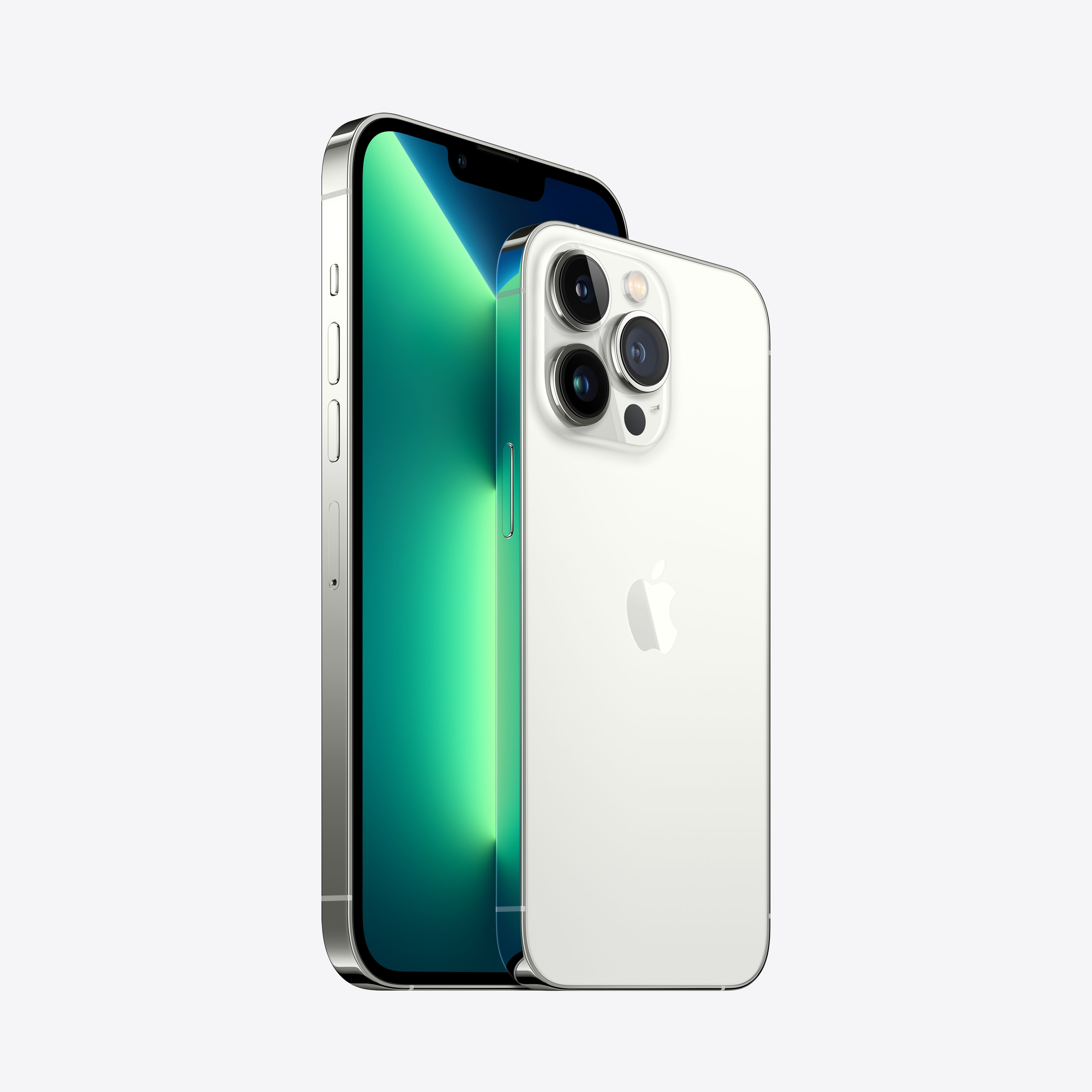 Dos teléfonos Apple iPhone 13 Pro. Uno plateado, otro blanco, ambos con tres cámaras y el logo de Apple.