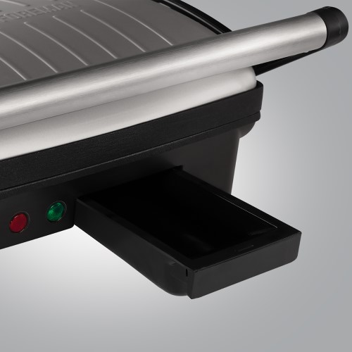 Fekete és szürke Foreman grill kihúzott olajteknővel. Piros és zöld lámpák láthatók.