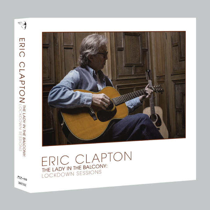 Albumcover: Eric Clapton spielt Gitarre in einem Raum, eine zweite Gitarre sichtbar.
