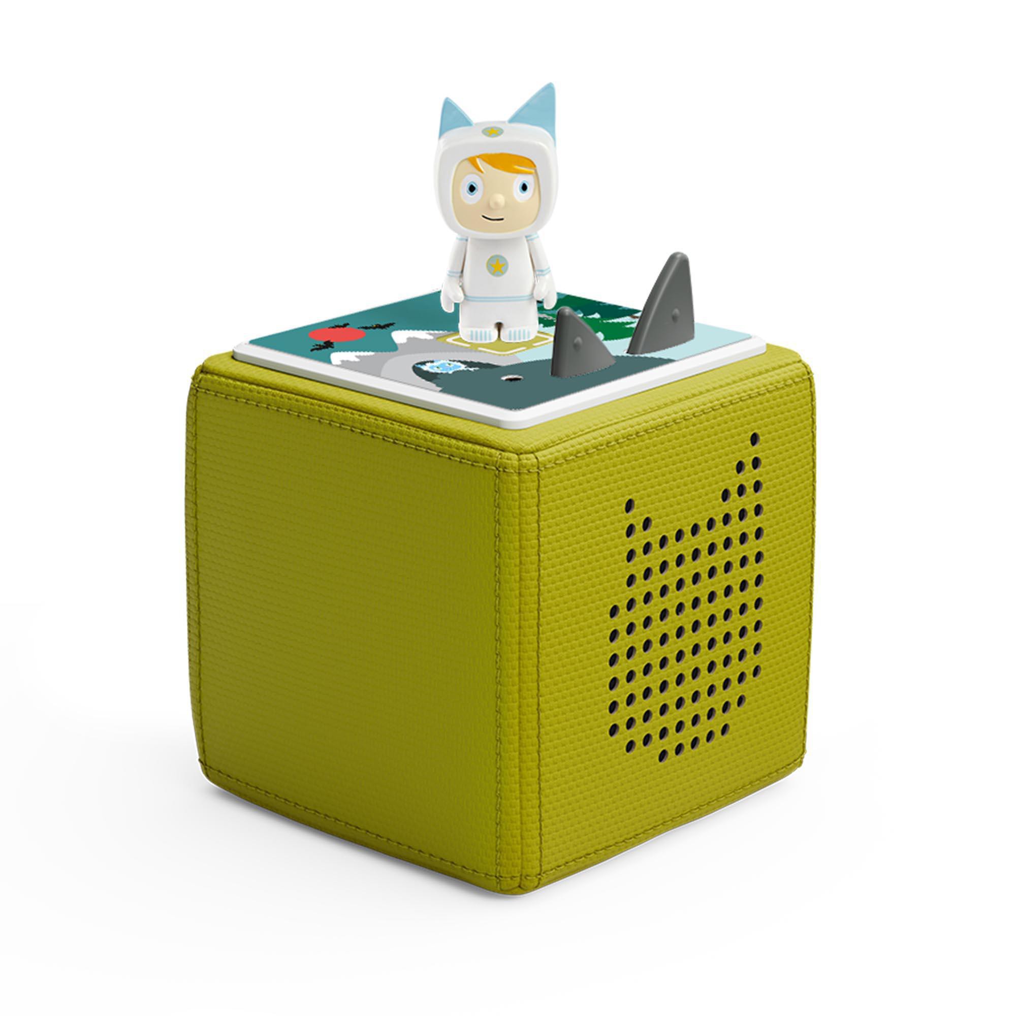Grüne Toniebox mit Figur oben drauf. Die Box hat eine Hai- und Kind-Illustration.