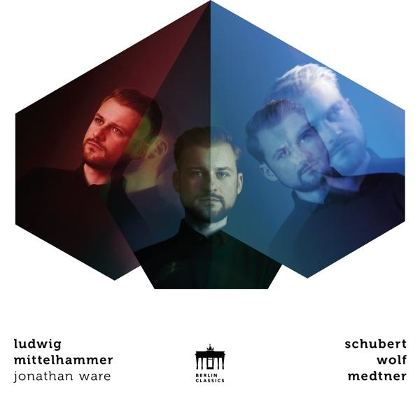 Albumcover mit drei Männern, geometrische Formen.