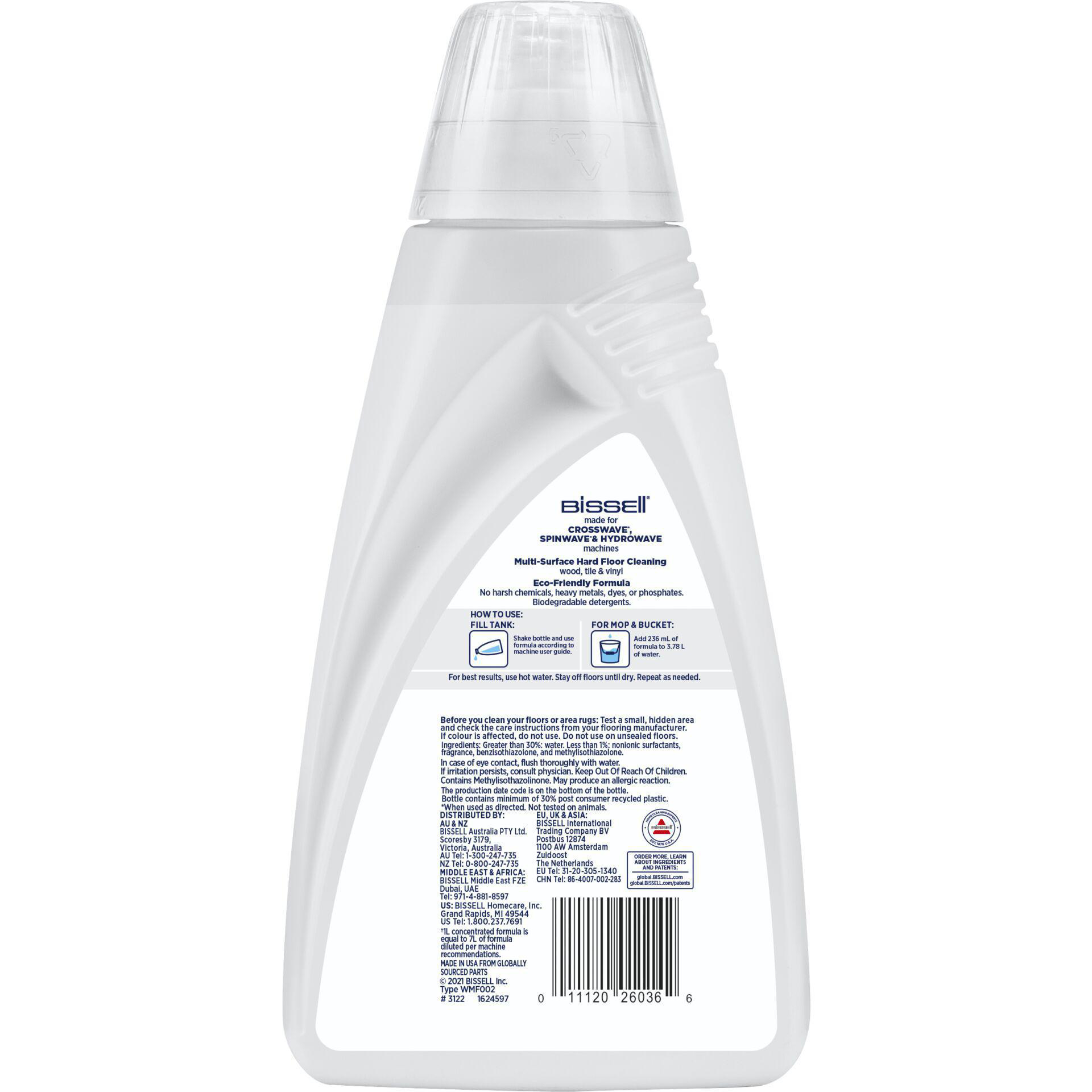 Weiße Flasche Reinigungsmittel mit Text und weißem Hintergrund, Produktetikett sichtbar.