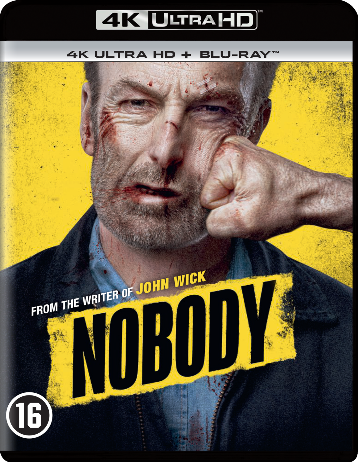 Couverture du film 'Nobody', visage en gros plan, poing frappant, sang, fond jaune.