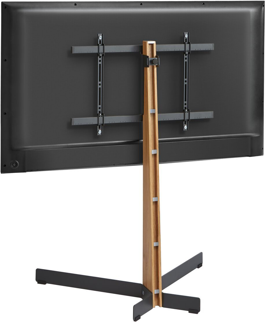 L'arrière d'un téléviseur monté sur un support en bois. Le support a une base en croix.