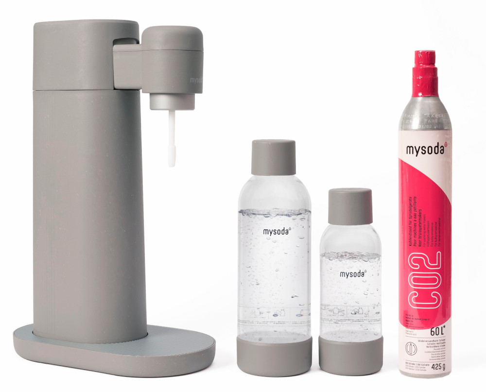 A gray soda maker with two bottles and a CO2 cylinder isolated on a white background.