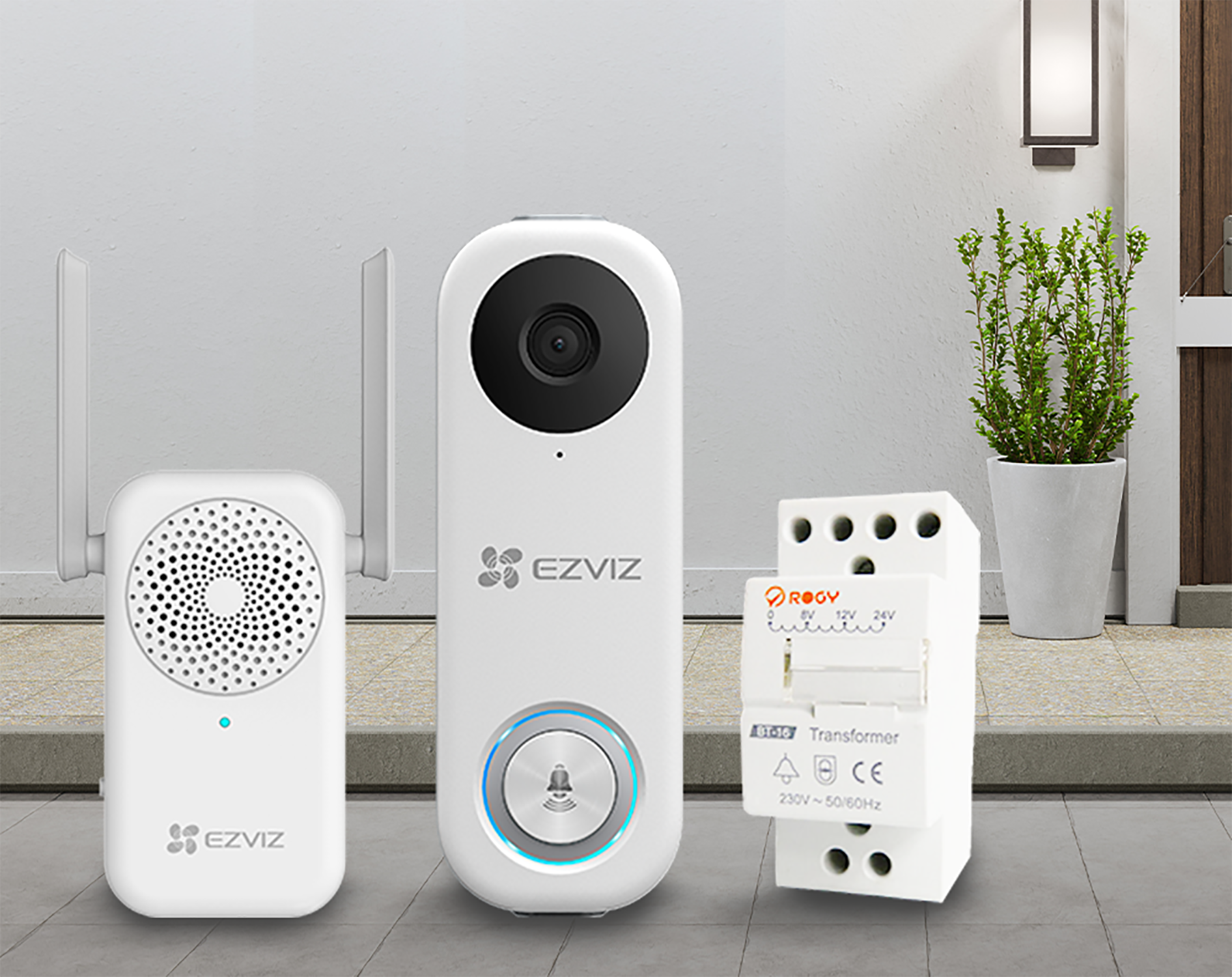 A white doorbell system. Includes a camera, a chime, and a transformer. Outdoors setting.
