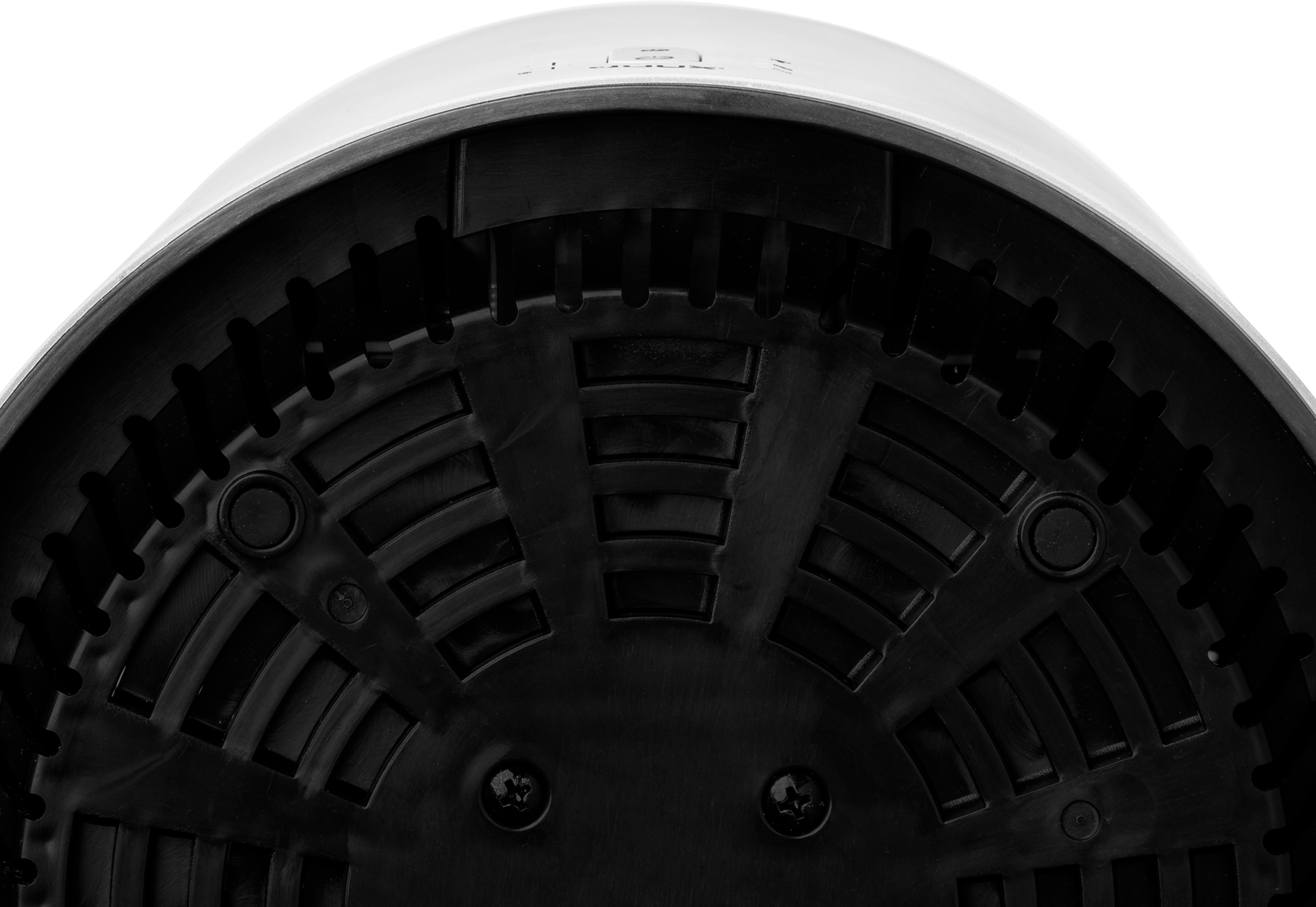 Underside of a white object with black details and screws.