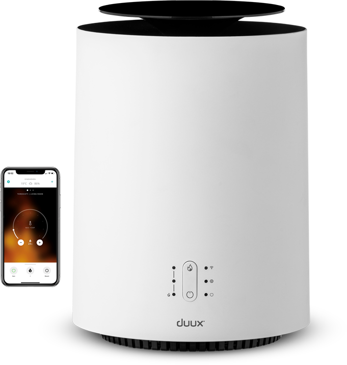White, cylindrical air purifier with a black top. A smartphone shows the settings. The word 'duux' is visible.