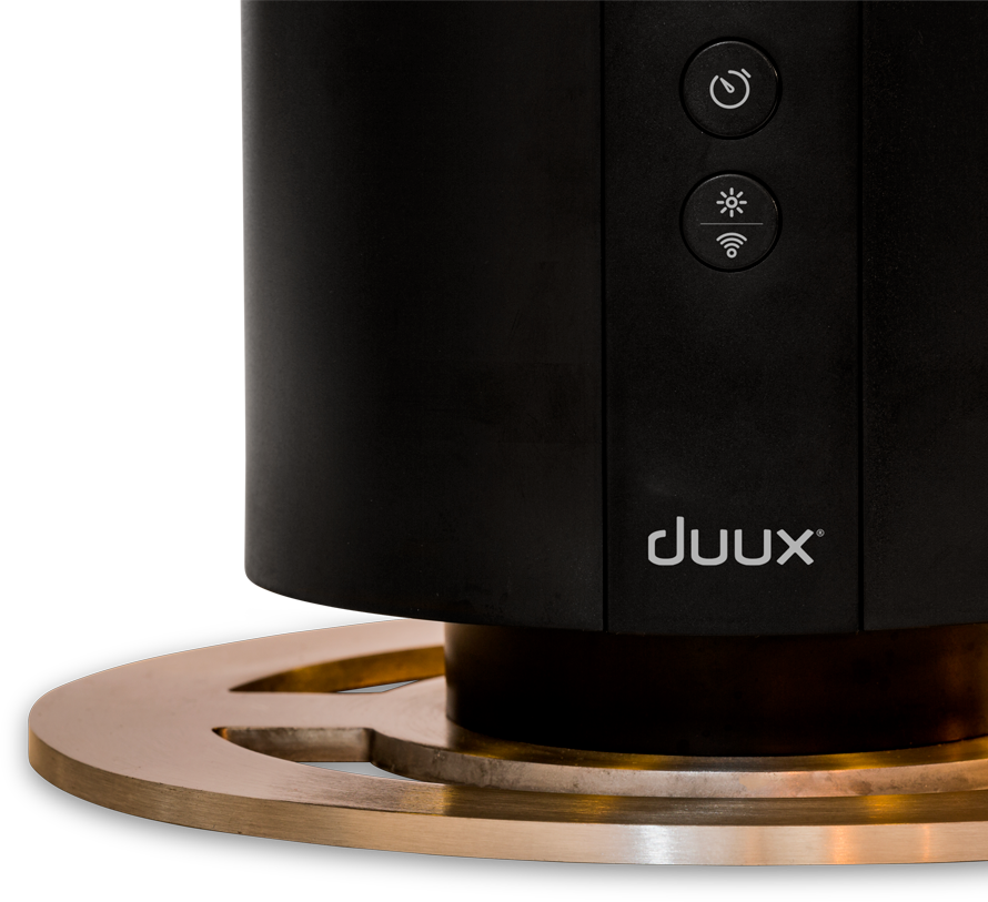 Zwart apparaat met knoppen en het duux-logo. Gouden basis.