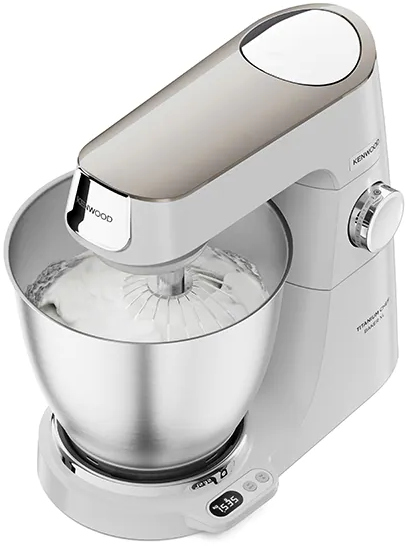 White Kenwood stand mixer with a silver bowl, whisk, and control panel.