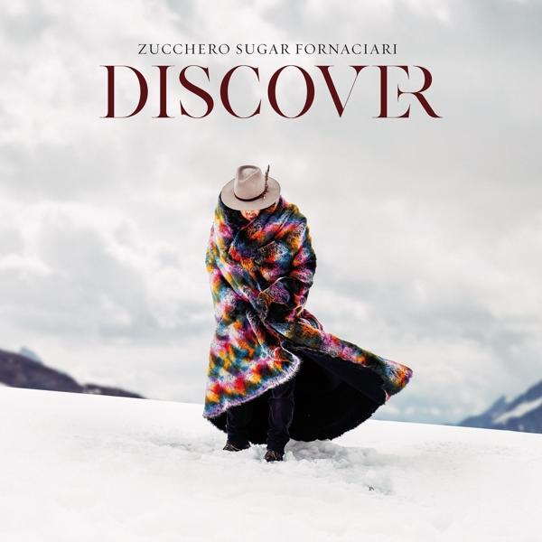 Pochette d'album. Une personne en manteau coloré dans la neige. Le titre 'Discover' en haut.
