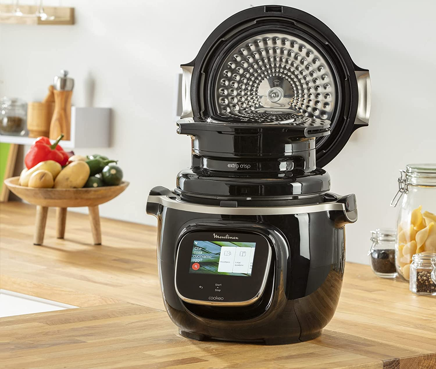 A black cooking appliance with an open lid.
