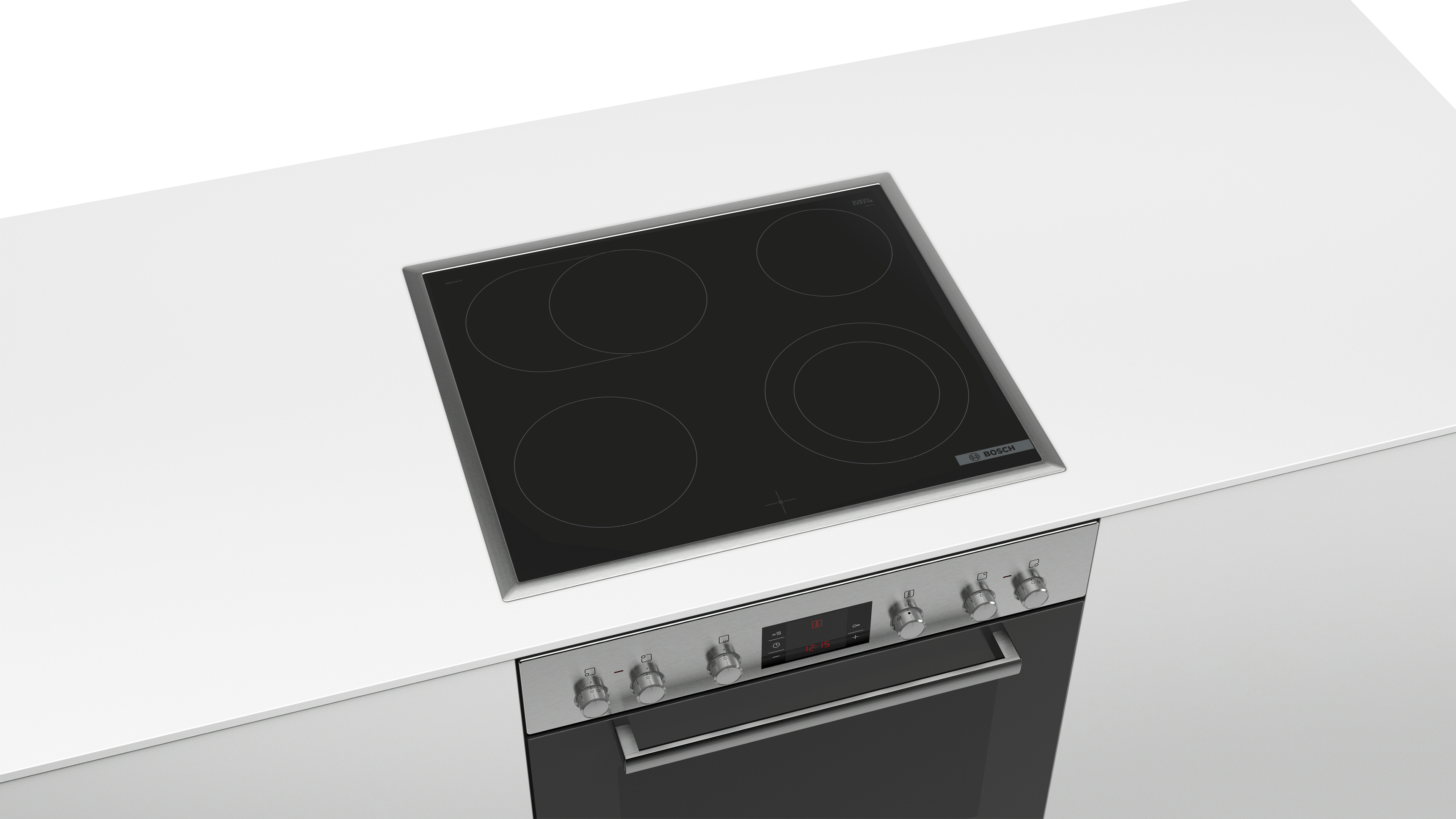 Eine weiße Arbeitsplatte mit einem eingebauten schwarzen Kochfeld und einem Backofen darunter.