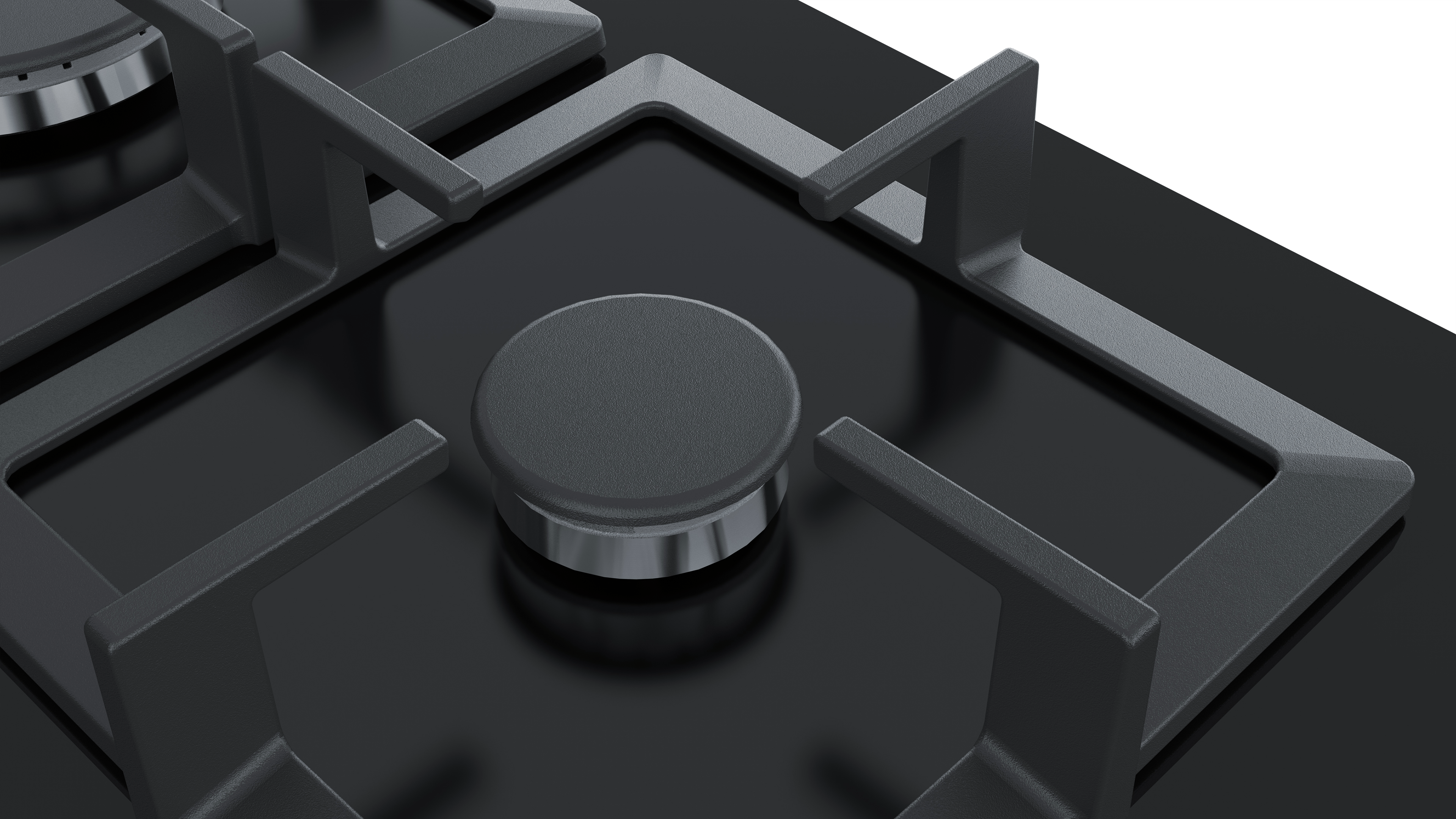 Close-up of black gas stove burners and a central knob.