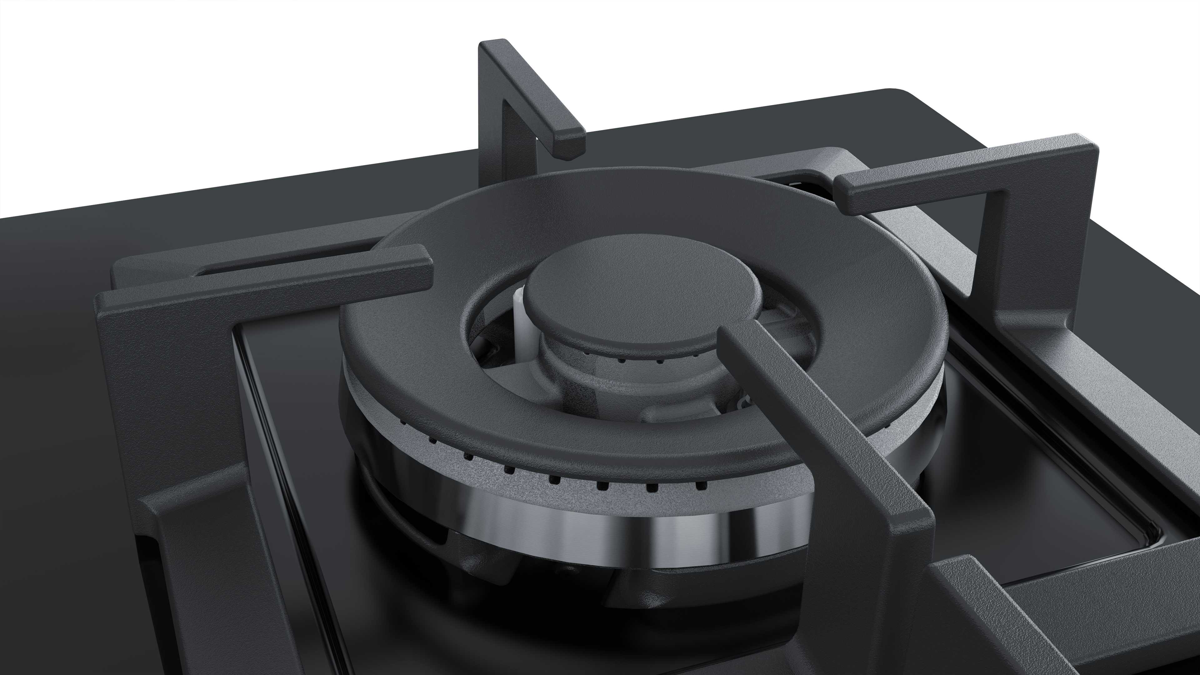 Close-up of a black gas stove burner with a silver ring.