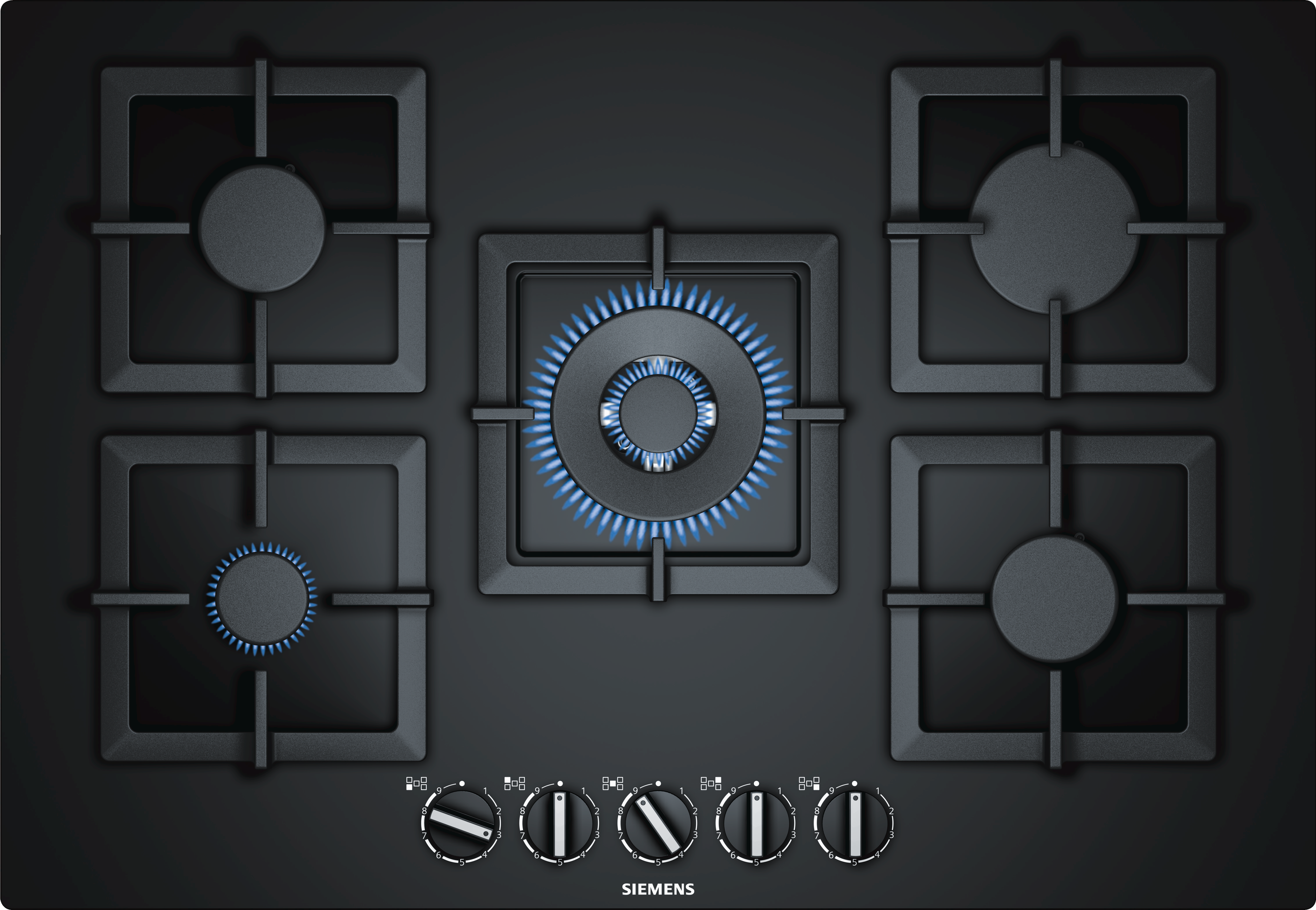 Top-down view of a black gas cooktop with five burners and control knobs.
