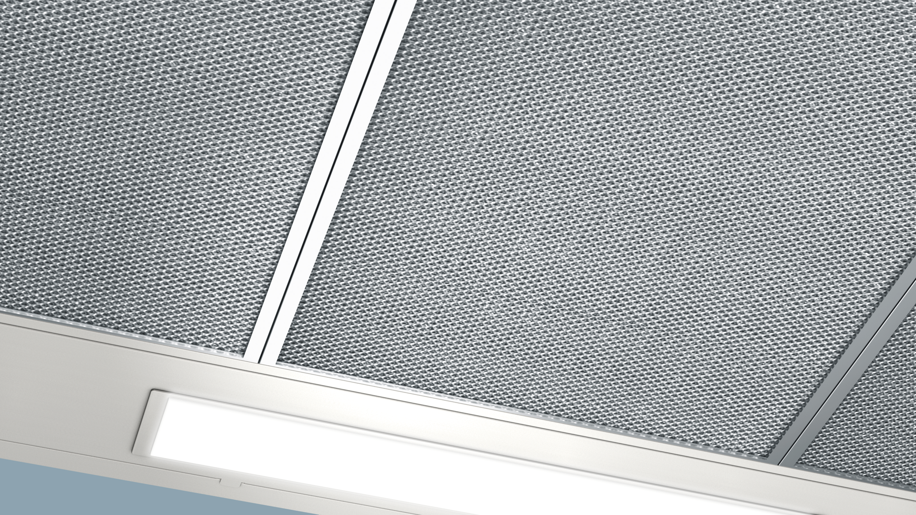 Close-up of a metallic mesh filter with white frames.