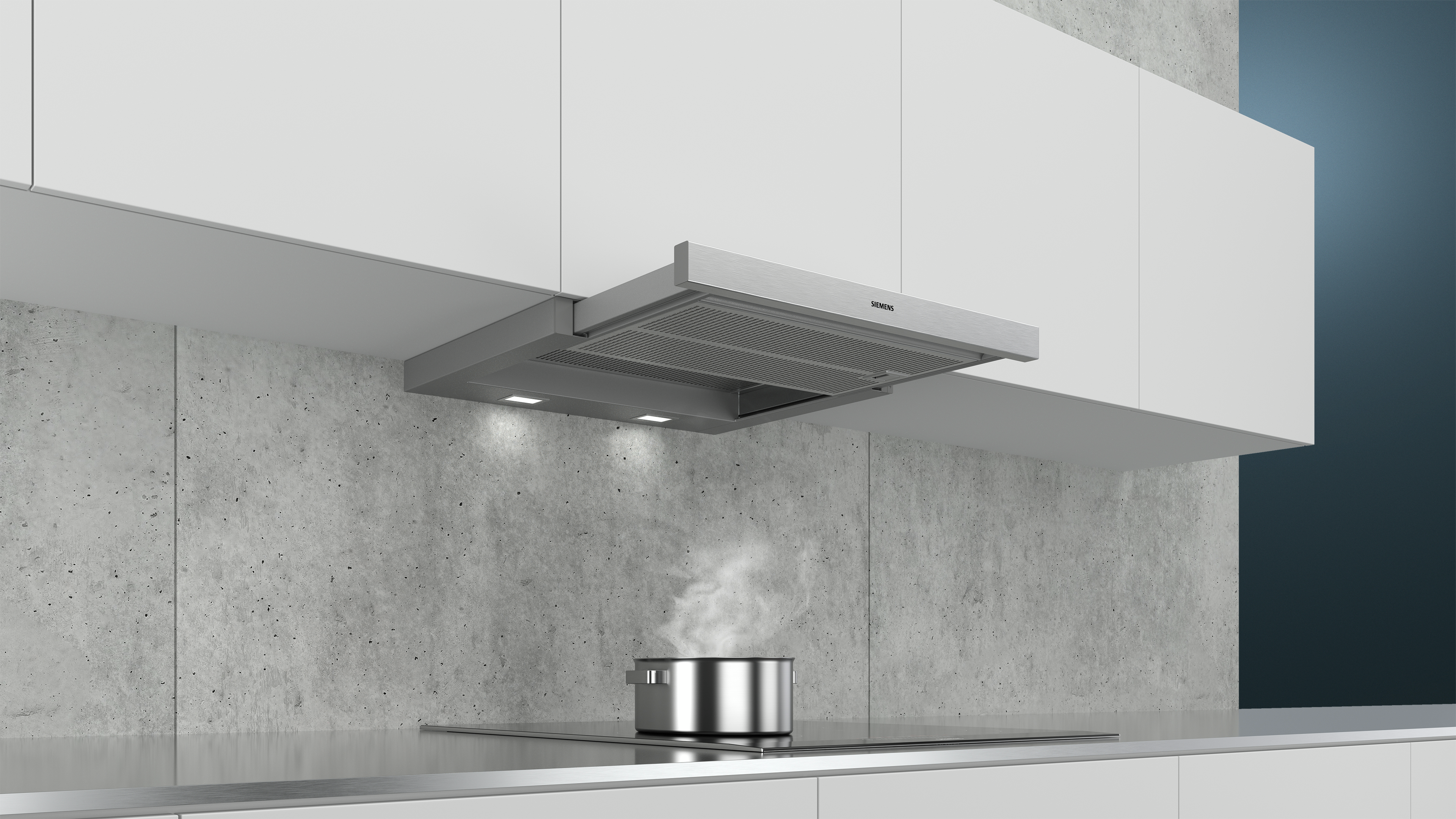 A kitchen with a range hood above a stove. Steam rises from a pot.