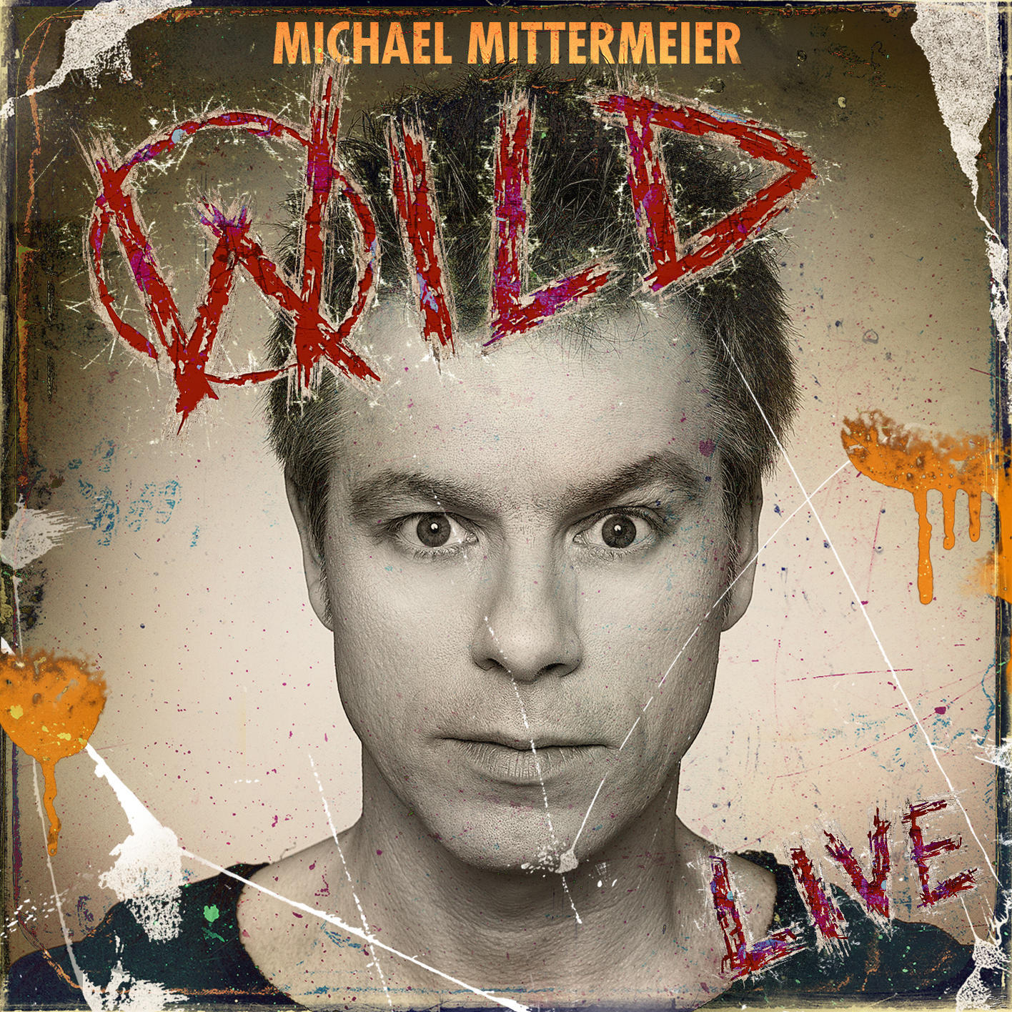 Albumcover mit Gesicht eines Mannes, dem Wort 'WILD' in Rot und Graffiti-Kunst.