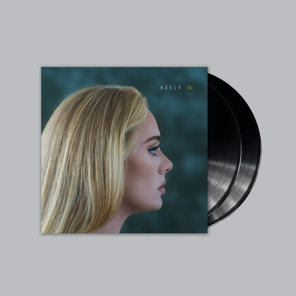 Adele's Album '30' Cover mit zwei schwarzen Vinyl-Schallplatten auf grauem Hintergrund.