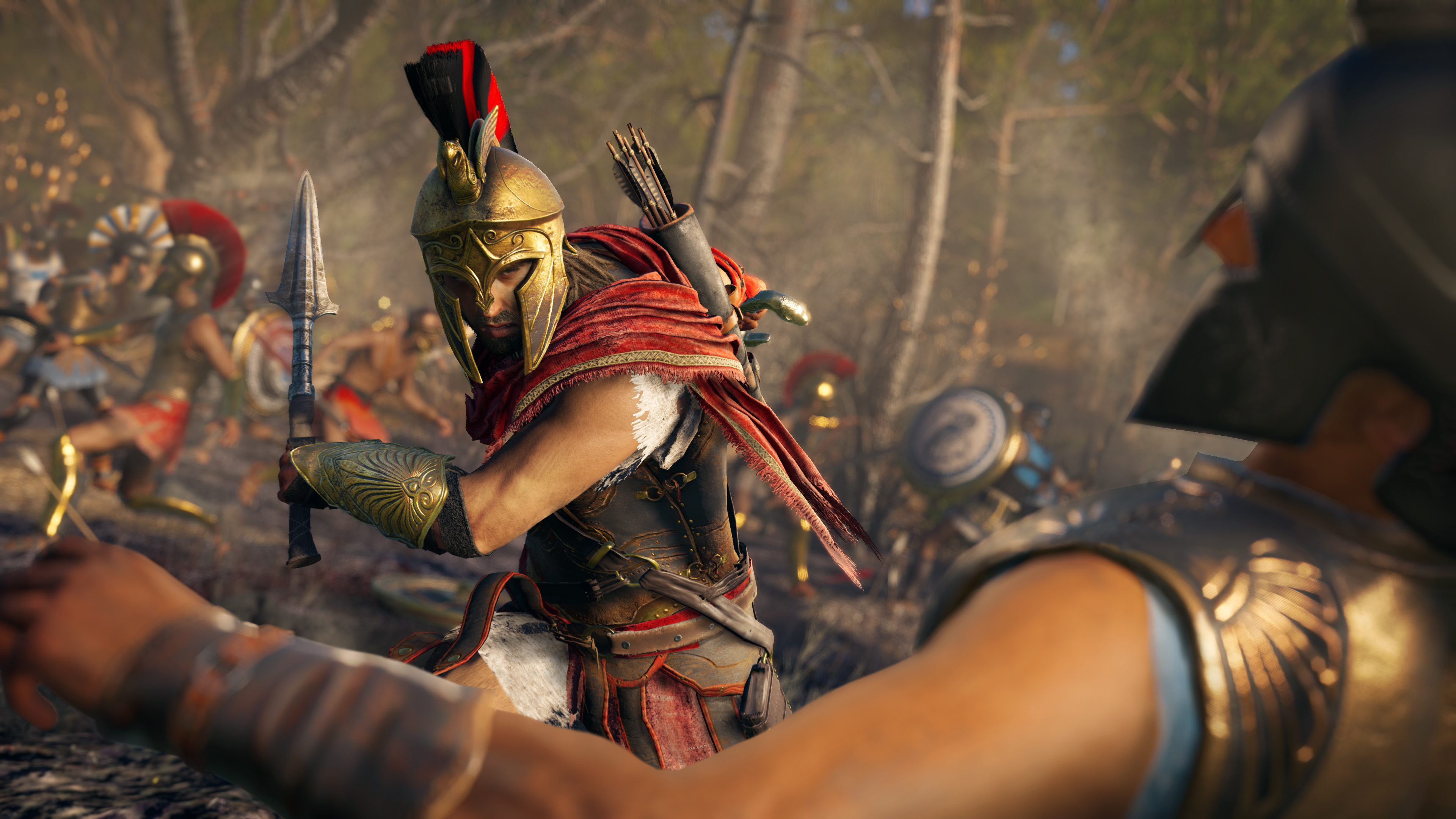 Ein Krieger in Goldhelm bereitet sich auf den Kampf vor. Andere Krieger sind im Hintergrund mit Pfeilen.